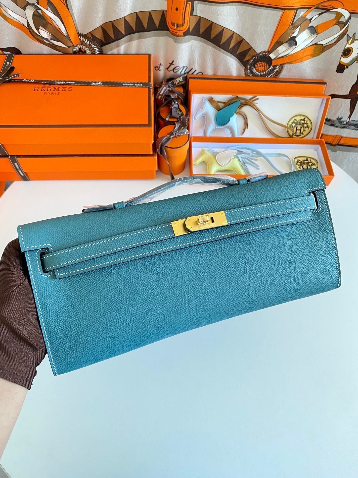HERMES KELLY CUT 31 IN AZURE BLUE CALFSKIN WITH GOLD HARDWARE