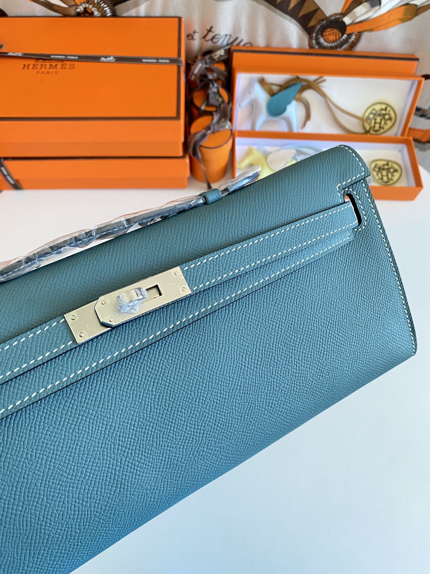 HERMES KELLY CUT 31 IN AZURE BLUE CALFSKIN WITH SILVER HARDWARE