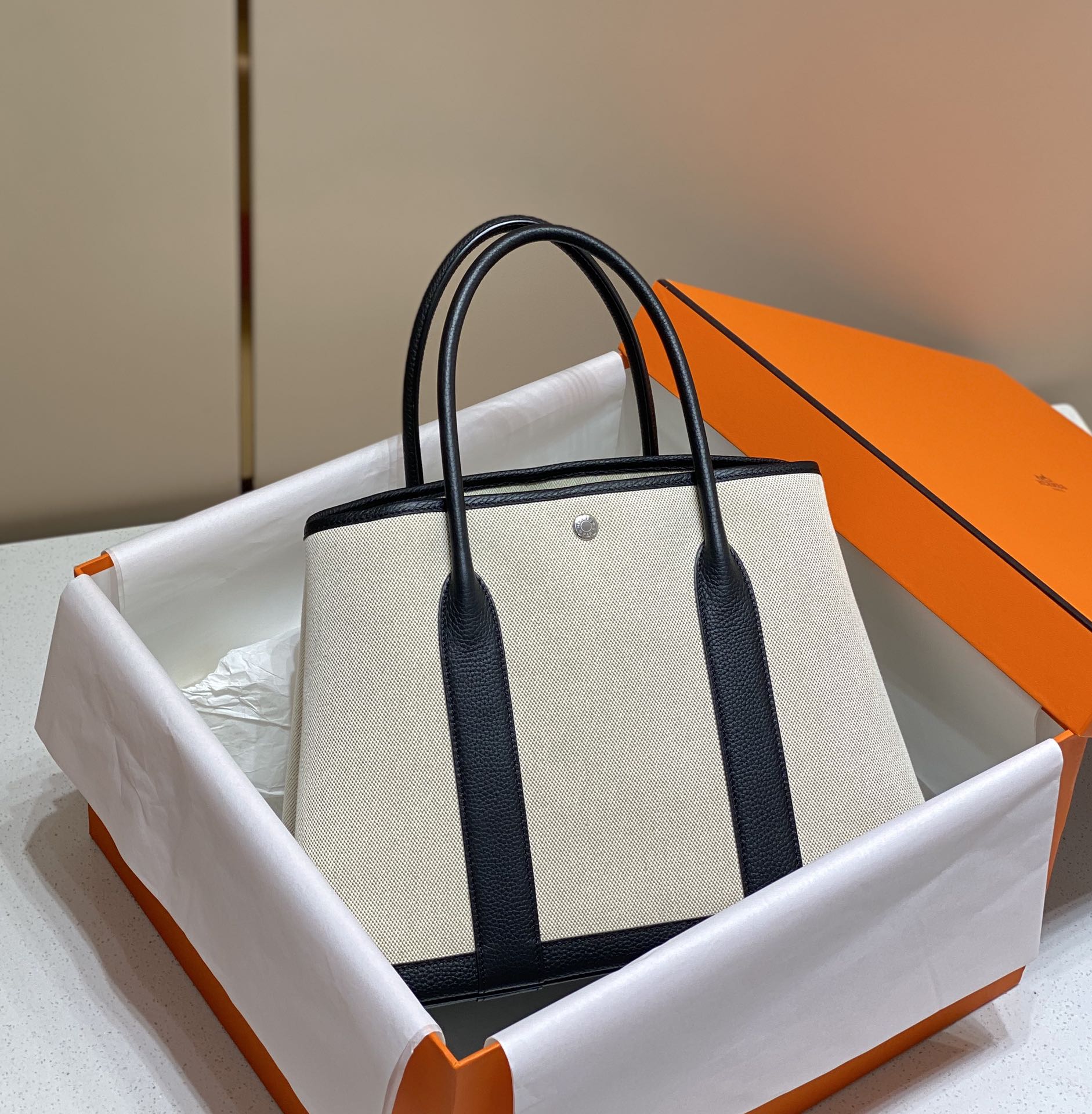 HERMES GARDEN PARTY 36CM IN WHITE TOILETS COTTON CANVAS AND BLACK CALFSKIN