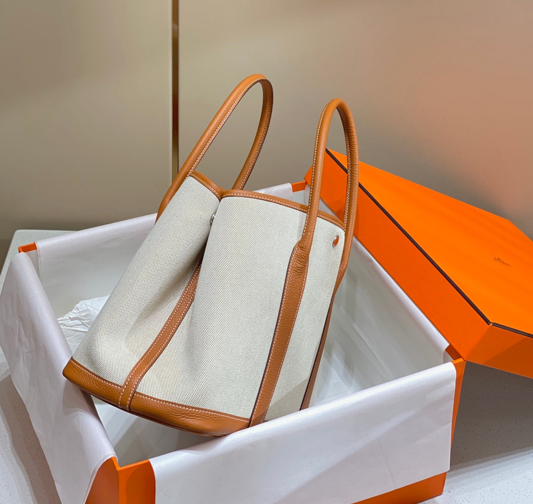 HERMES GARDEN PARTY 36CM IN WHITE TOILETS COTTON CANVAS AND BROWN CALFSKIN