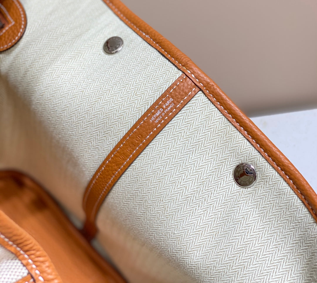 HERMES GARDEN PARTY 36CM IN WHITE TOILETS COTTON CANVAS AND BROWN CALFSKIN