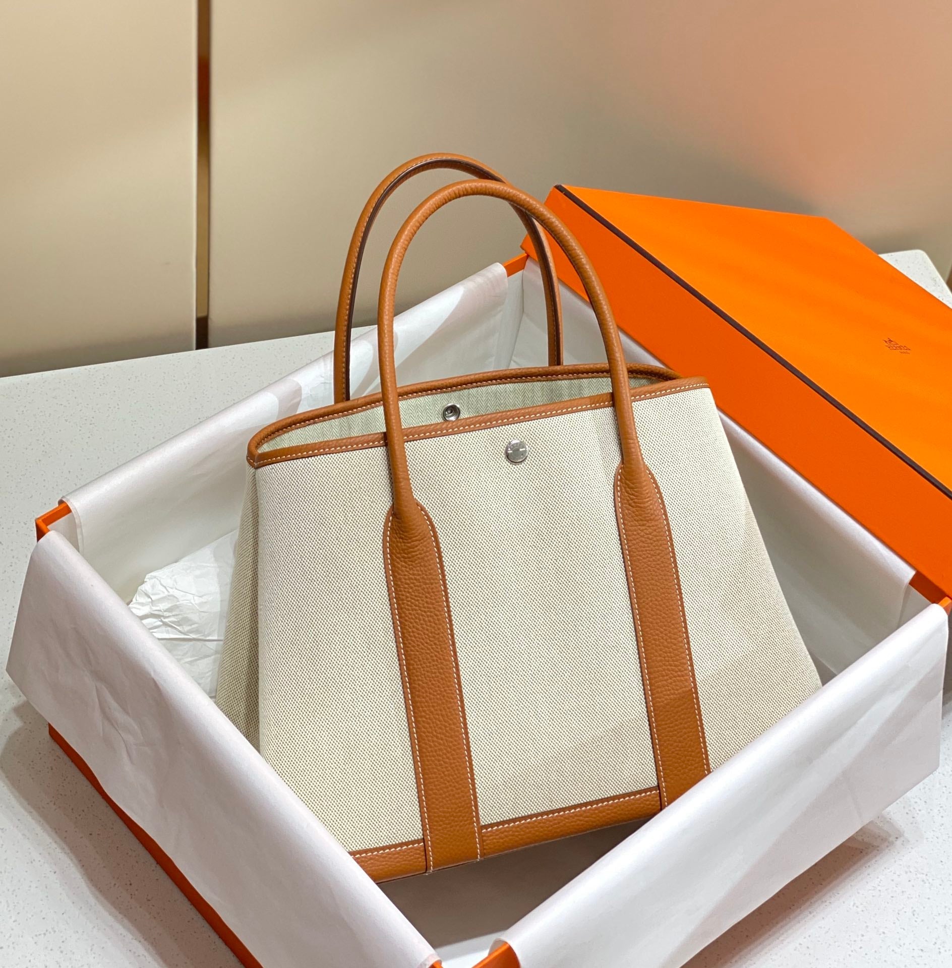HERMES GARDEN PARTY 36CM IN WHITE TOILETS COTTON CANVAS AND BROWN CALFSKIN