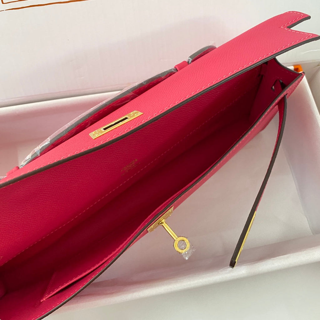 HERMES KELLY CUT 31 IN CHERRY RED CALFSKIN WITH GOLD HARDWARE