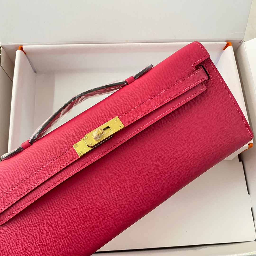 HERMES KELLY CUT 31 IN CHERRY RED CALFSKIN WITH GOLD HARDWARE