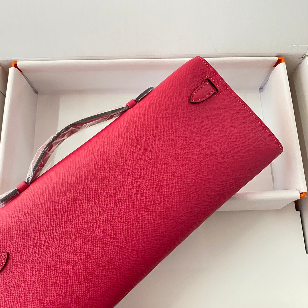 HERMES KELLY CUT 31 IN CHERRY RED CALFSKIN WITH SILVER HARDWARE
