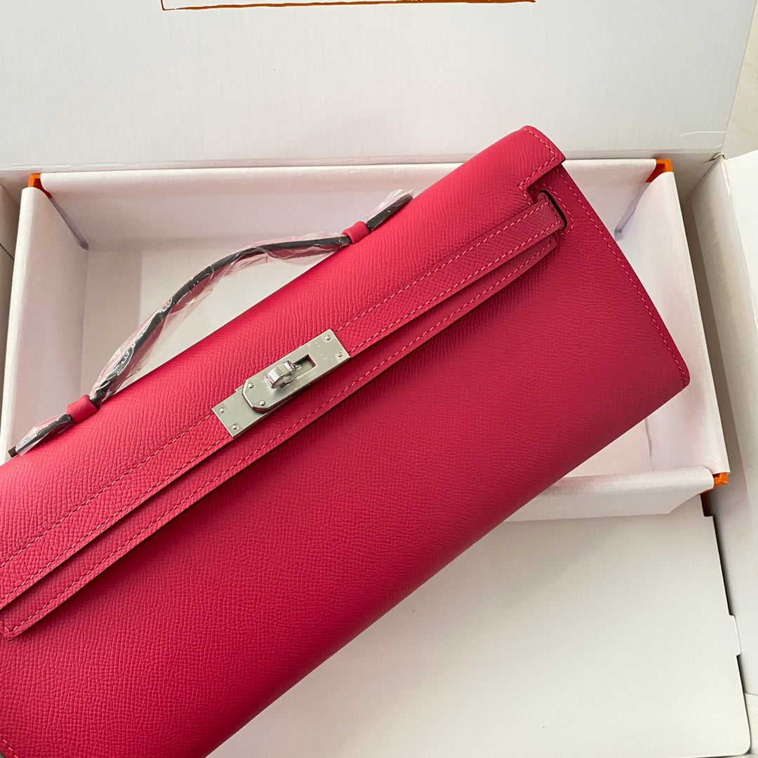 HERMES KELLY CUT 31 IN CHERRY RED CALFSKIN WITH SILVER HARDWARE