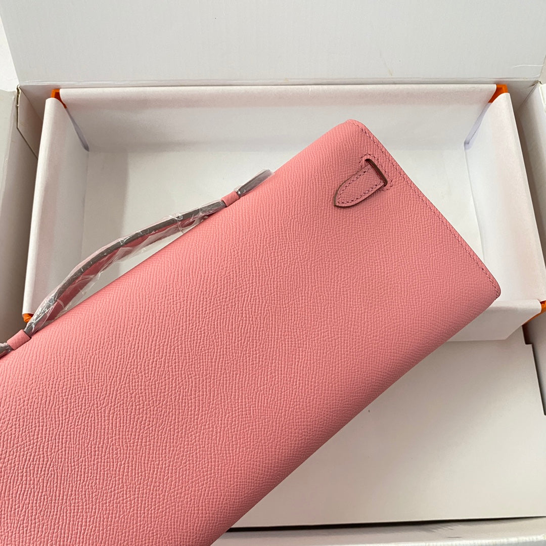 HERMES KELLY CUT 31 IN SALMON PINK CALFSKIN WITH SILVER HARDWARE