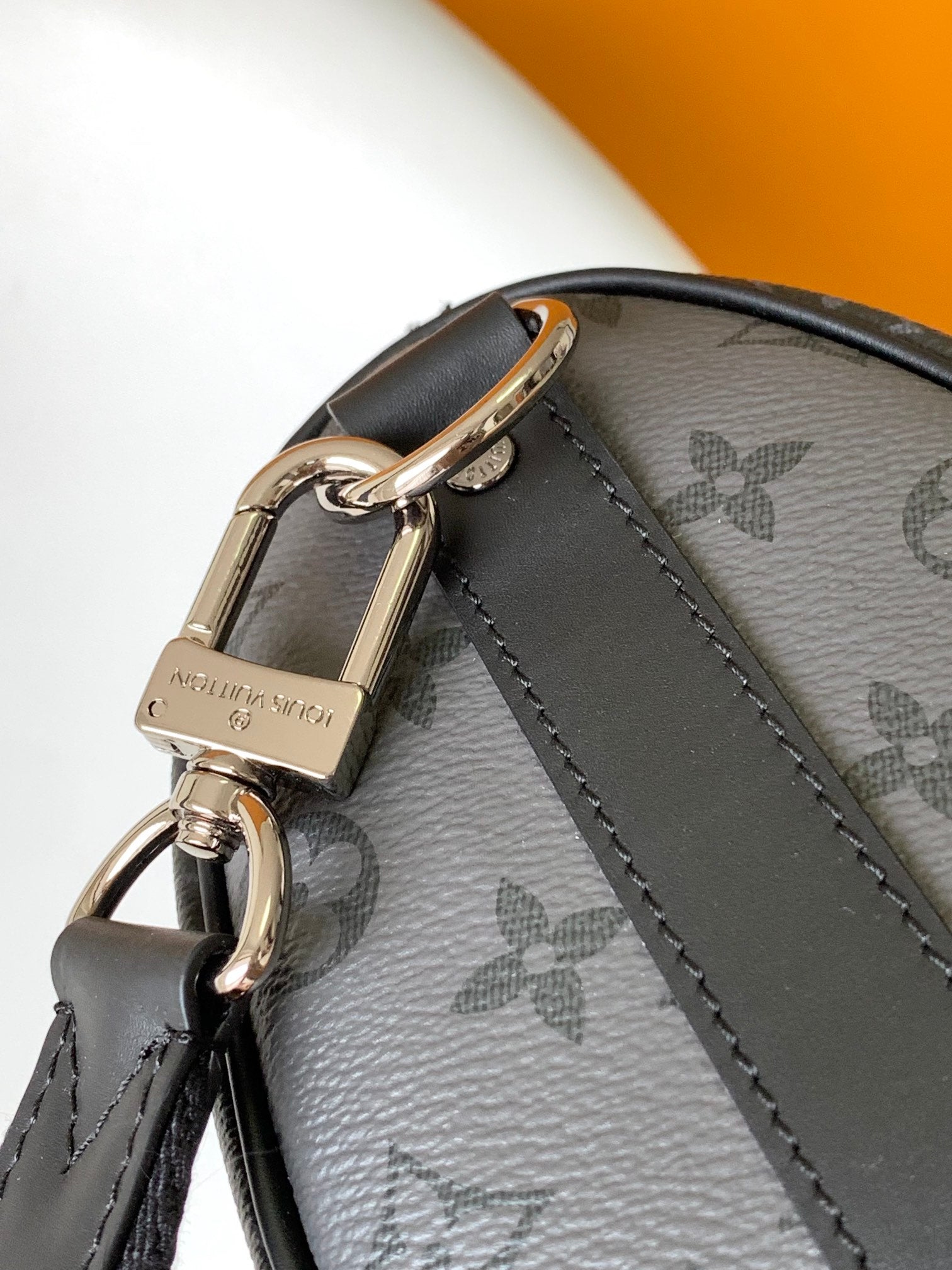 LOUIS VUITTON KEEPALL BANDOULIÈRE 25 IN BLACK MONOGRAM HERITAGE CANVAS