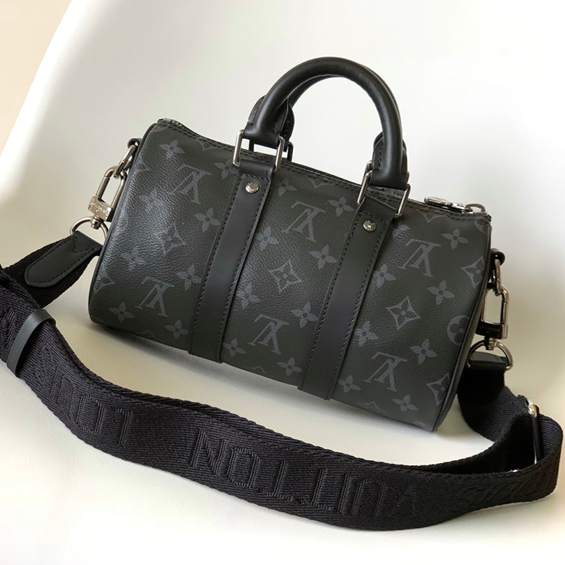 LOUIS VUITTON KEEPALL BANDOULIÈRE 25 IN BLACK MONOGRAM HERITAGE CANVAS