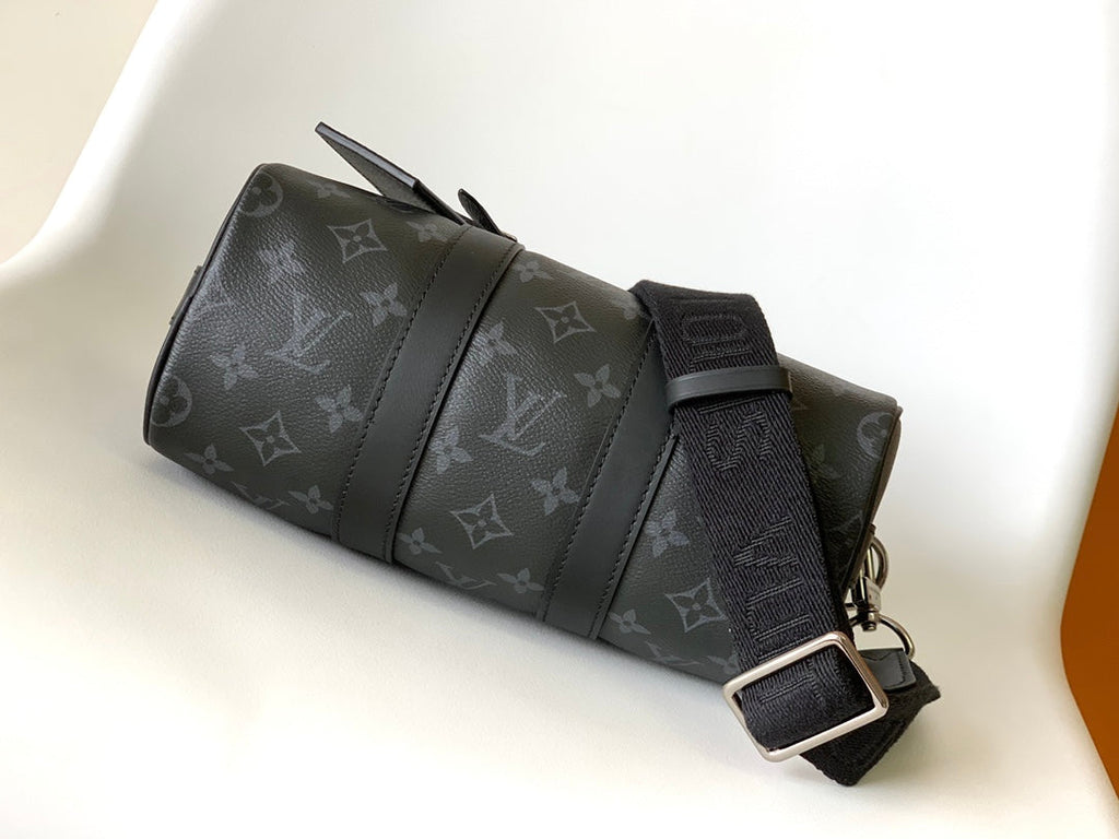 LOUIS VUITTON KEEPALL BANDOULIÈRE 25 IN BLACK MONOGRAM HERITAGE CANVAS