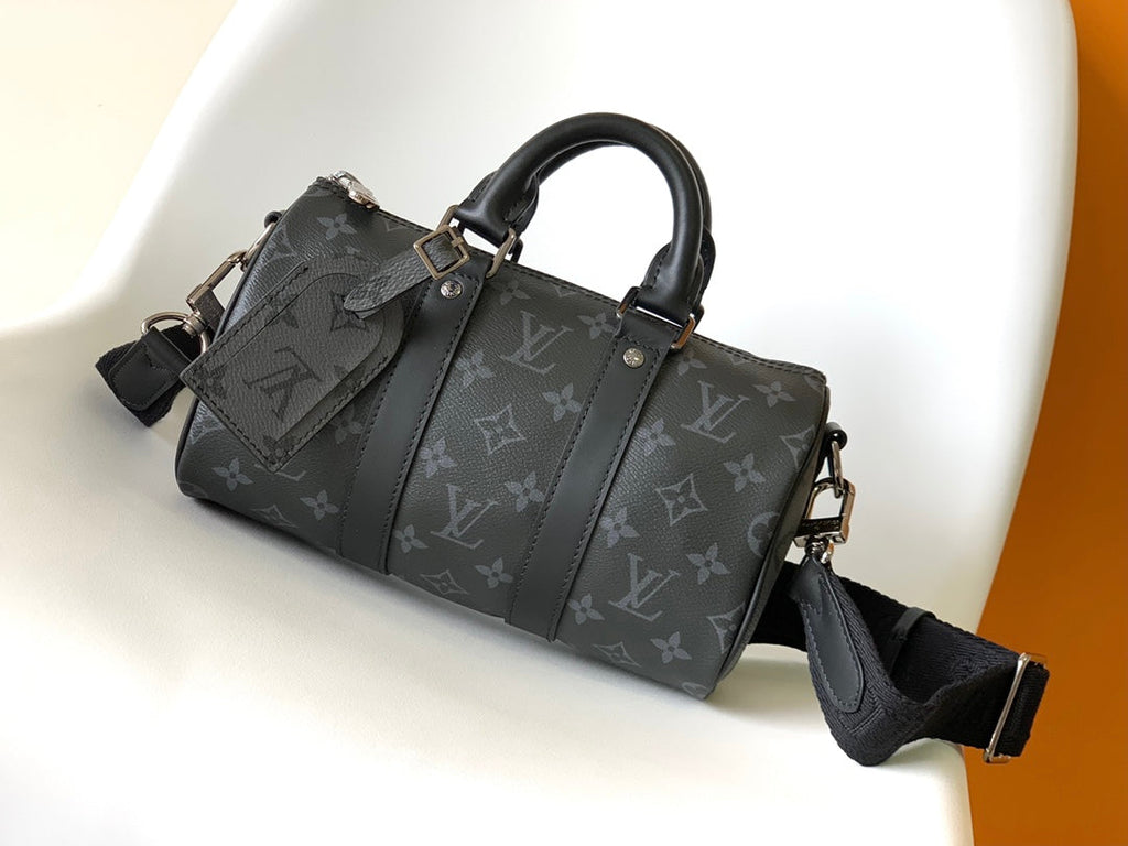 LOUIS VUITTON KEEPALL BANDOULIÈRE 25 IN BLACK MONOGRAM HERITAGE CANVAS