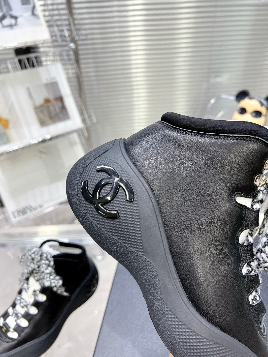 CHANEL CANO ALTO SNEAKER IN BLACK CALFSKIN AND RUBBER
