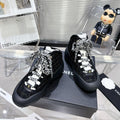 CHANEL CANO ALTO SNEAKER IN BLACK TWEED AND RUBBER