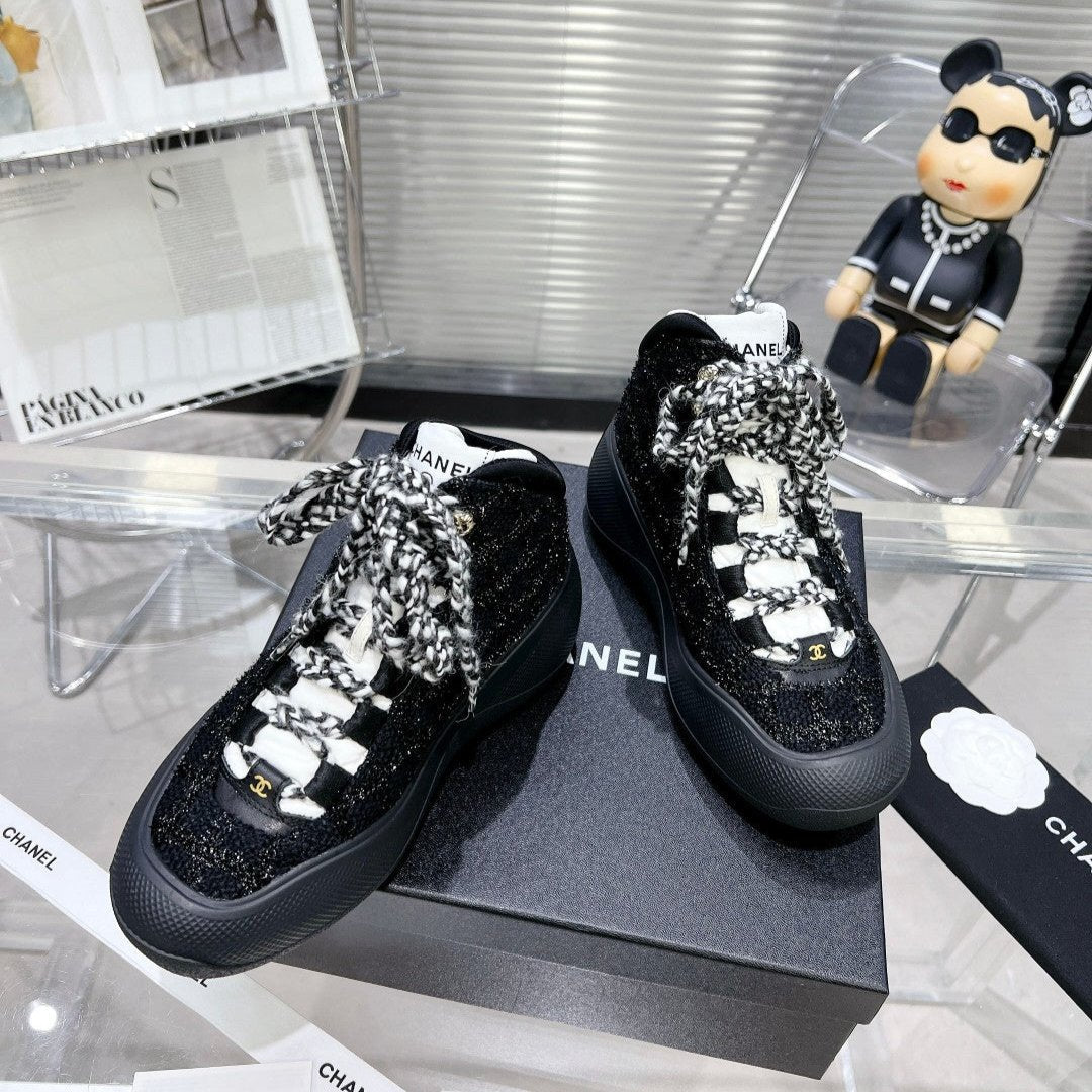 CHANEL CANO ALTO SNEAKER IN BLACK TWEED AND RUBBER