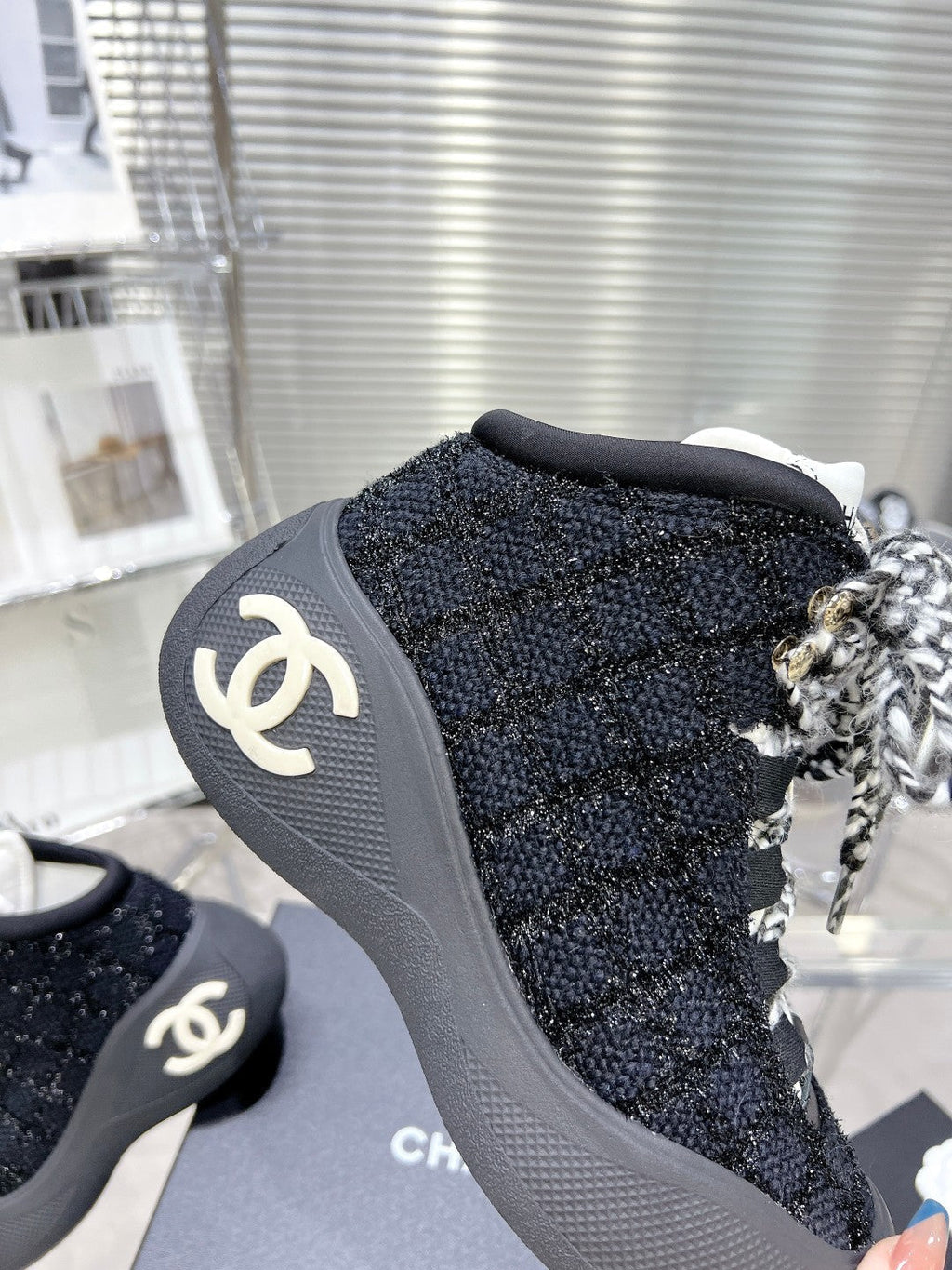CHANEL CANO ALTO SNEAKER IN BLACK TWEED AND RUBBER