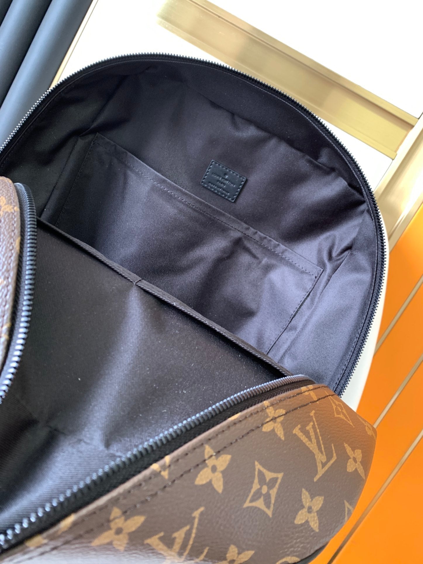 LOUIS VUITTON DEAN BACKPACK 42 IN BLACK AND BROWN MONOGRAM CANVAS
