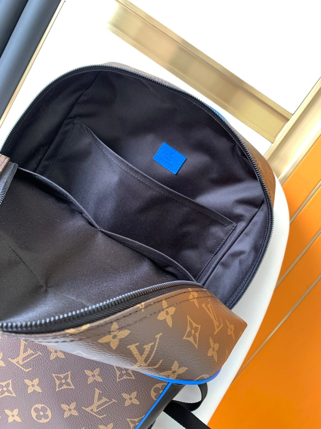 LOUIS VUITTON DEAN BACKPACK 42 IN BLUE AND BROWN MONOGRAM CANVAS