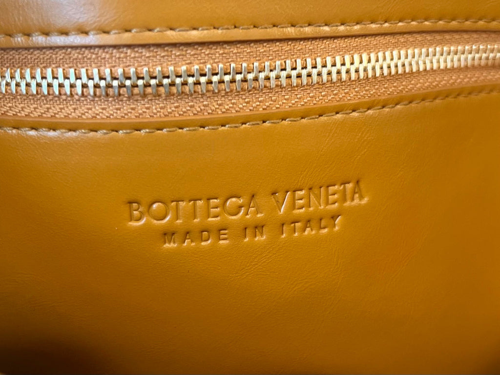 BOTTEGA VENETA CASSETTE 28 IN SANDSTONE ORANGE SOFT LAMBSKIN