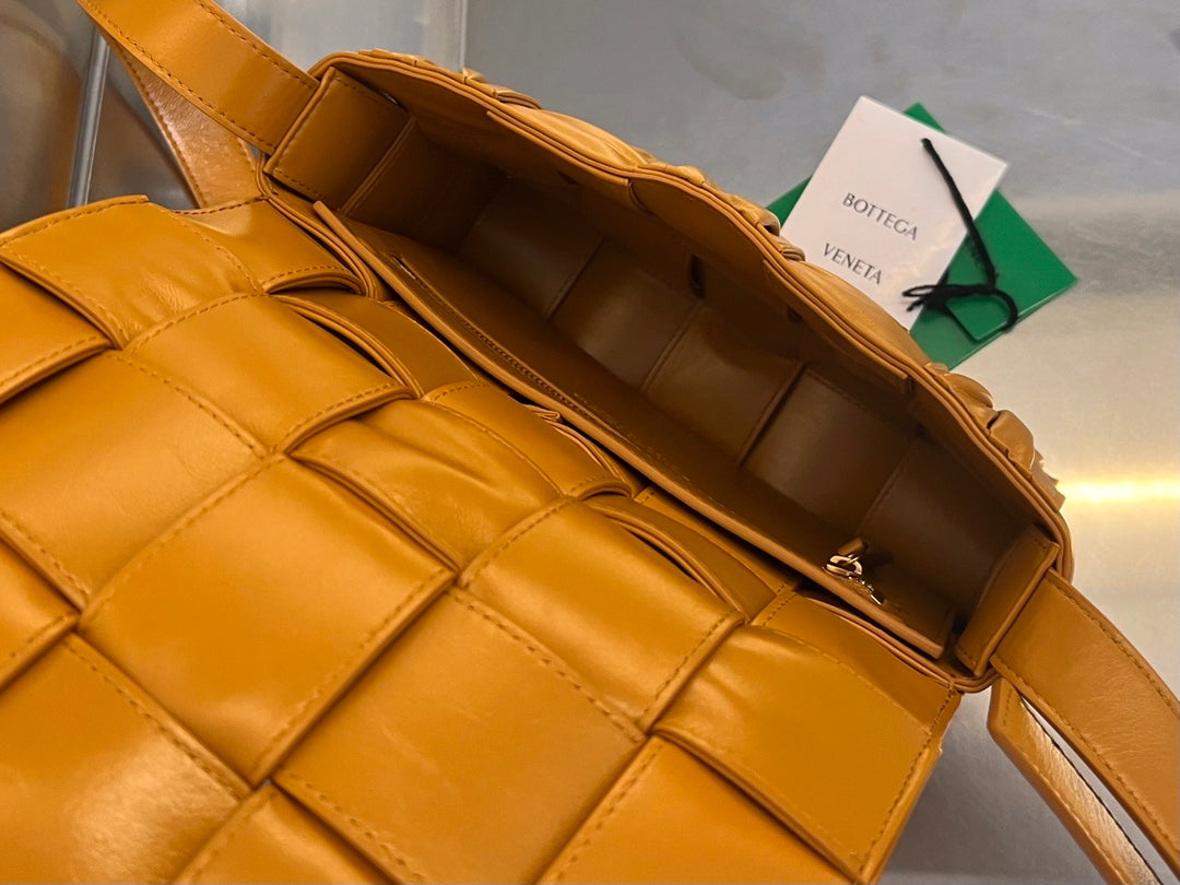 BOTTEGA VENETA CASSETTE 28 IN SANDSTONE ORANGE SOFT LAMBSKIN