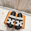 HERMES CHYPRE SANDAL BLACK AND WHITE LAMBSKIN
