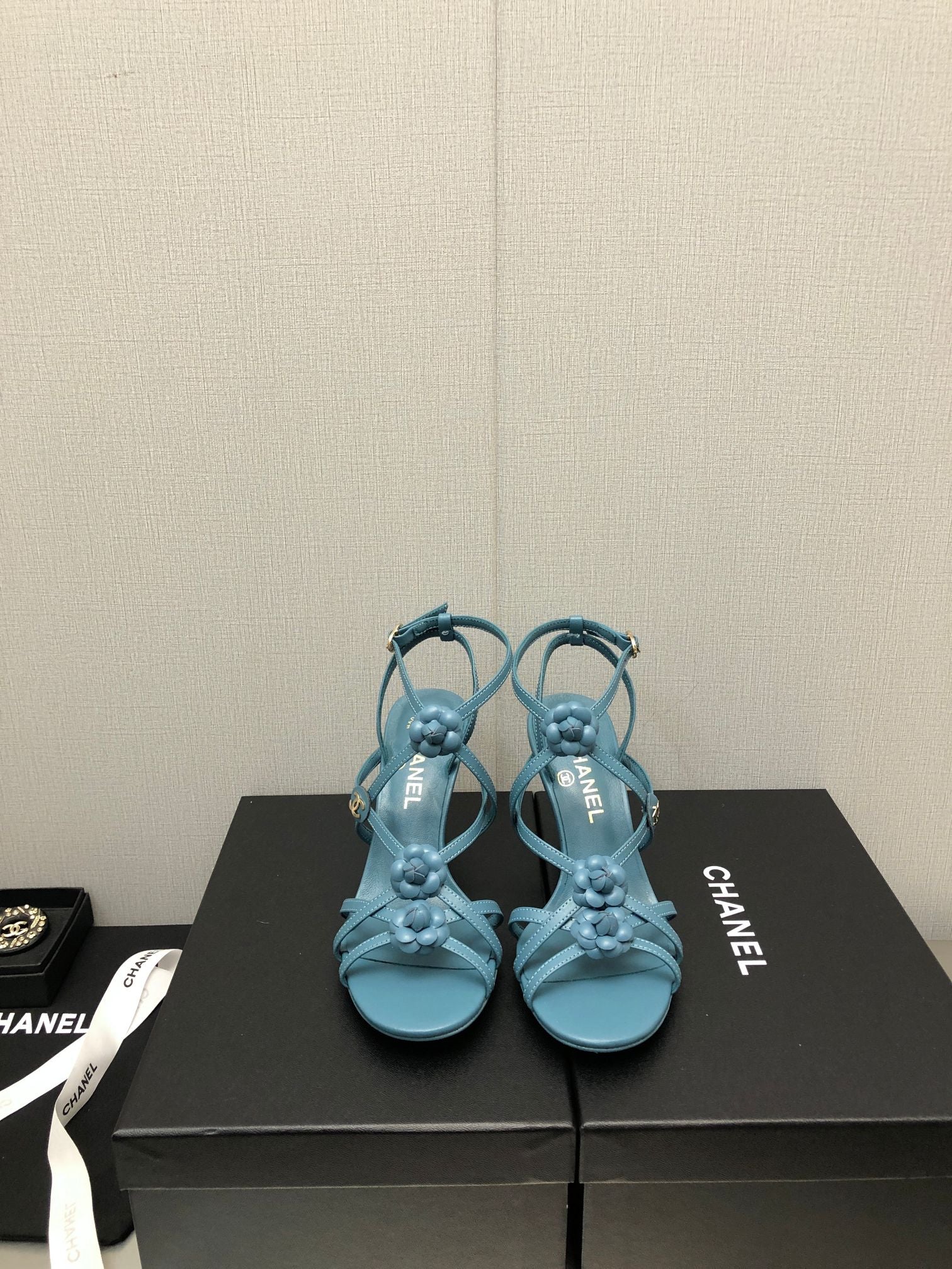 CHANEL FLORAL HIGH HEEL SANDAL IN SAPPHIRE BLUE LAMBSKIN