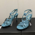 CHANEL FLORAL HIGH HEEL SANDAL IN SAPPHIRE BLUE LAMBSKIN