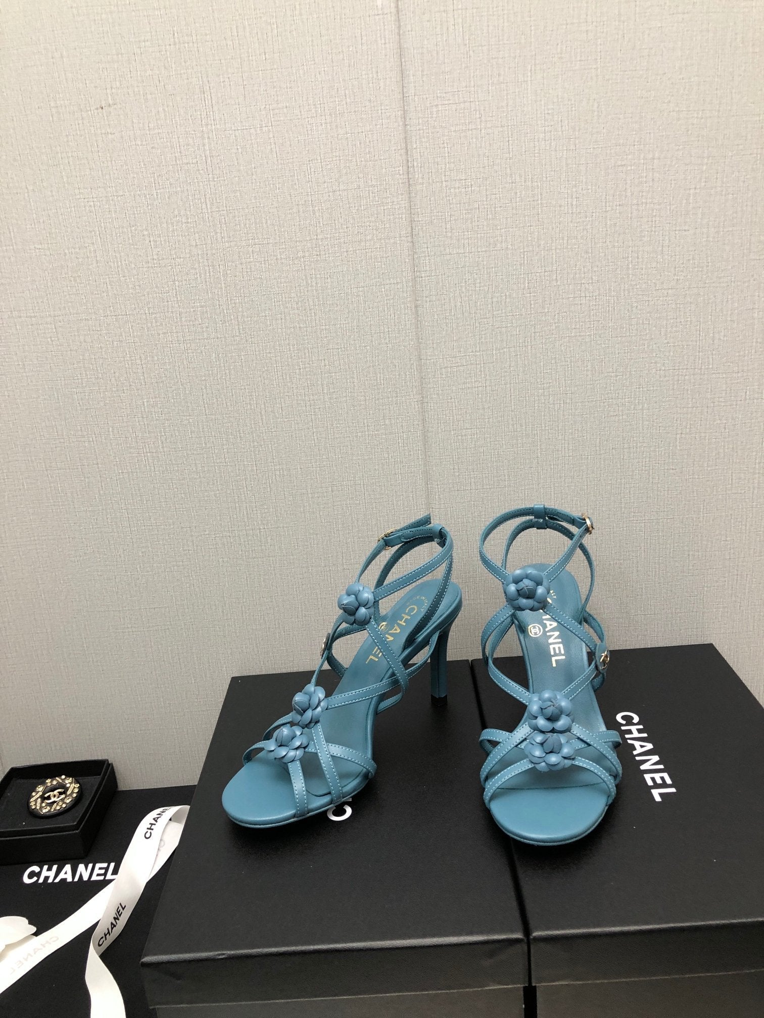 CHANEL FLORAL HIGH HEEL SANDAL IN SAPPHIRE BLUE LAMBSKIN