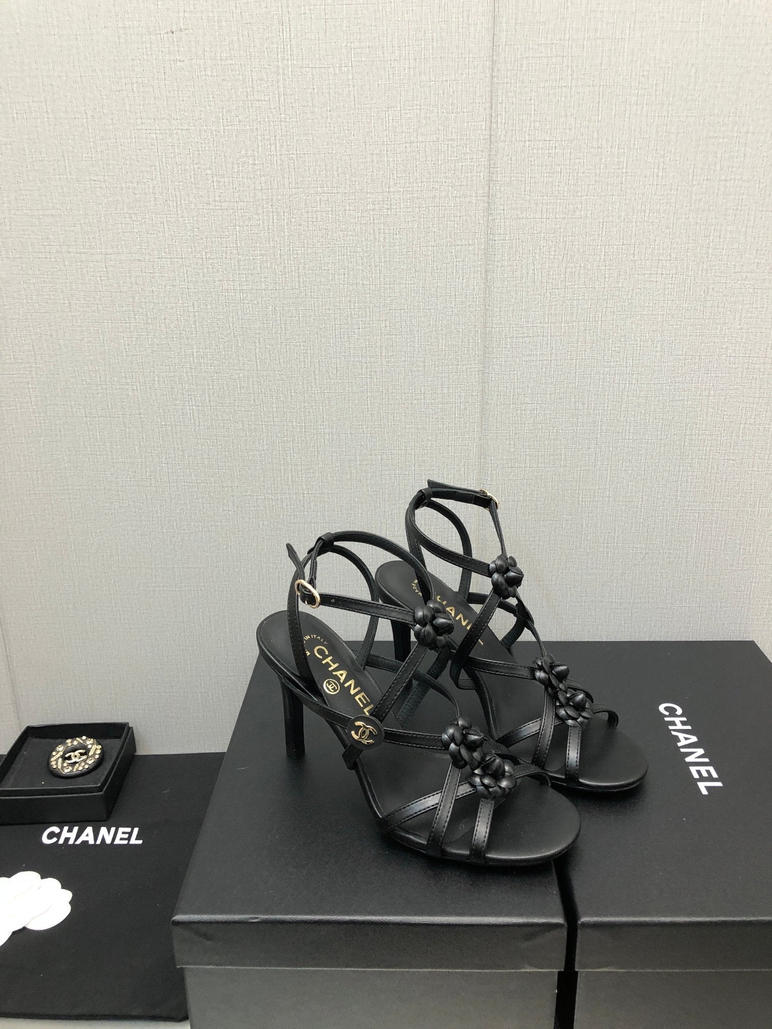CHANEL FLORAL HIGH HEEL SANDAL IN BLACK LAMBSKIN
