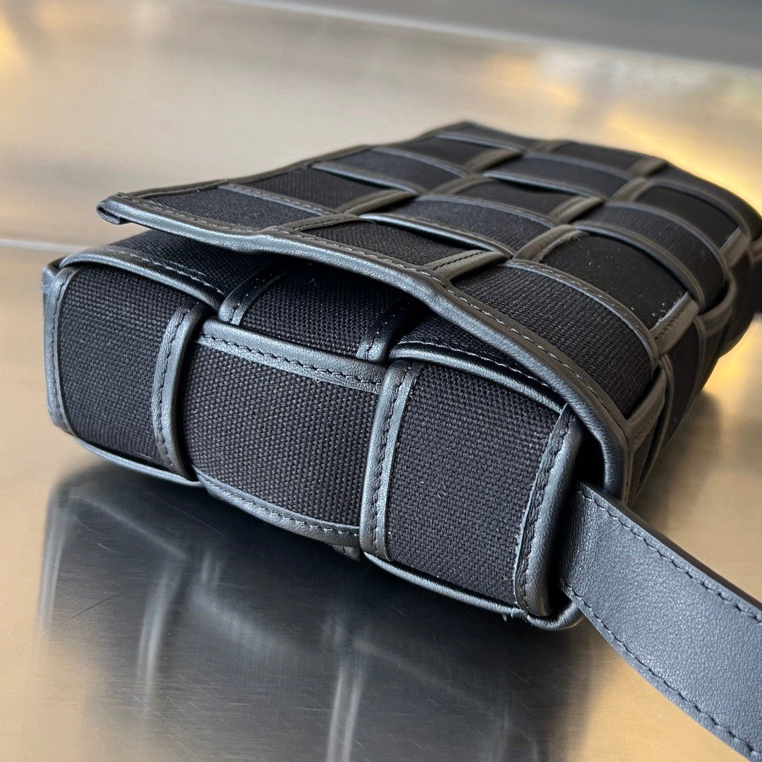 BOTTEGA VENETA SMALL CASSETTE 23 IN BLACK CANVAS AND CALFSKIN TRIM