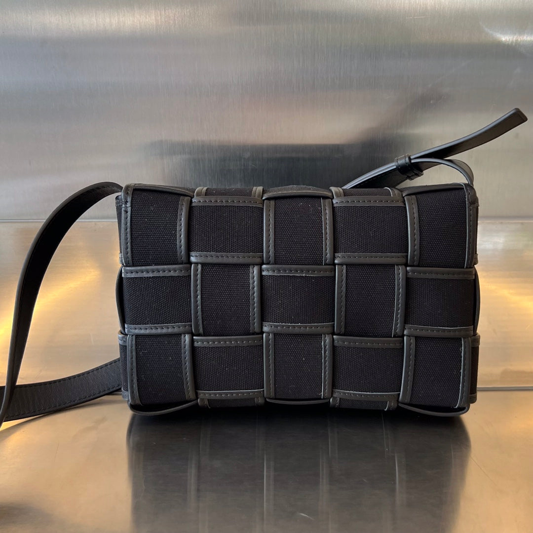 BOTTEGA VENETA SMALL CASSETTE 23 IN BLACK CANVAS AND CALFSKIN TRIM