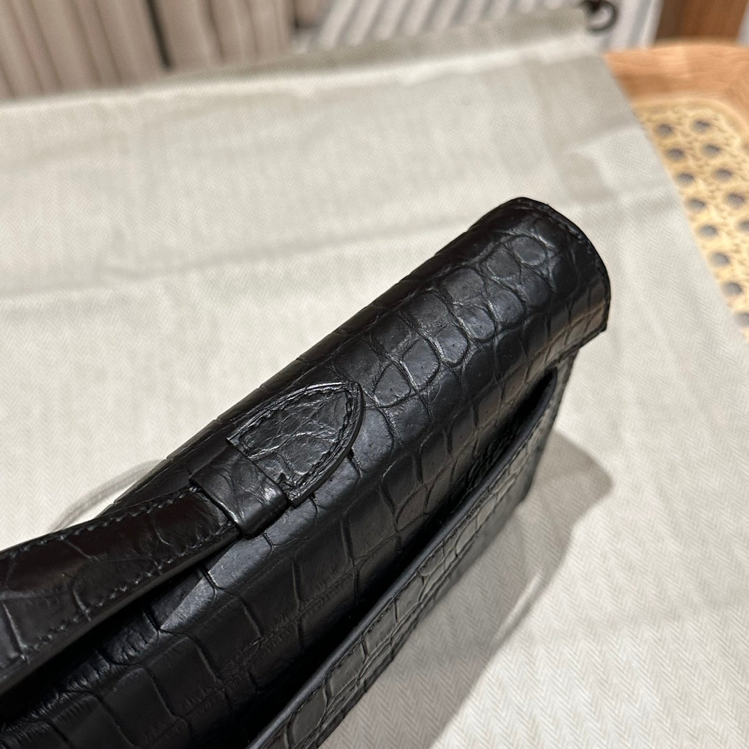 HERMES KELLY CUT 31 IN BLACK SHINY ALLIGATOR LEATHER WITH SILVER HARDWARE