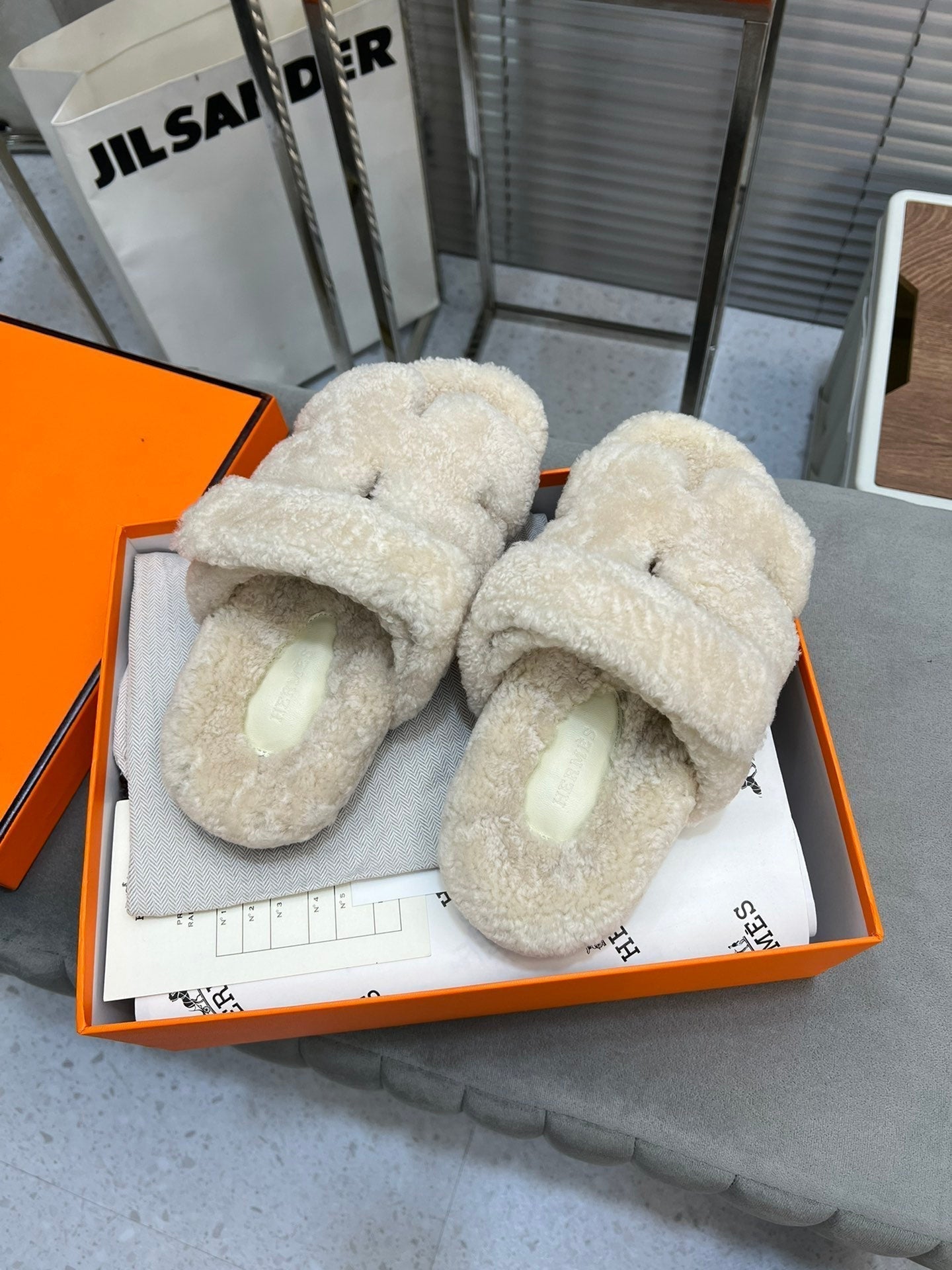 HERMES CHYPRE SLIPPERS IN BISQUE BEIGE LAMB WOOL