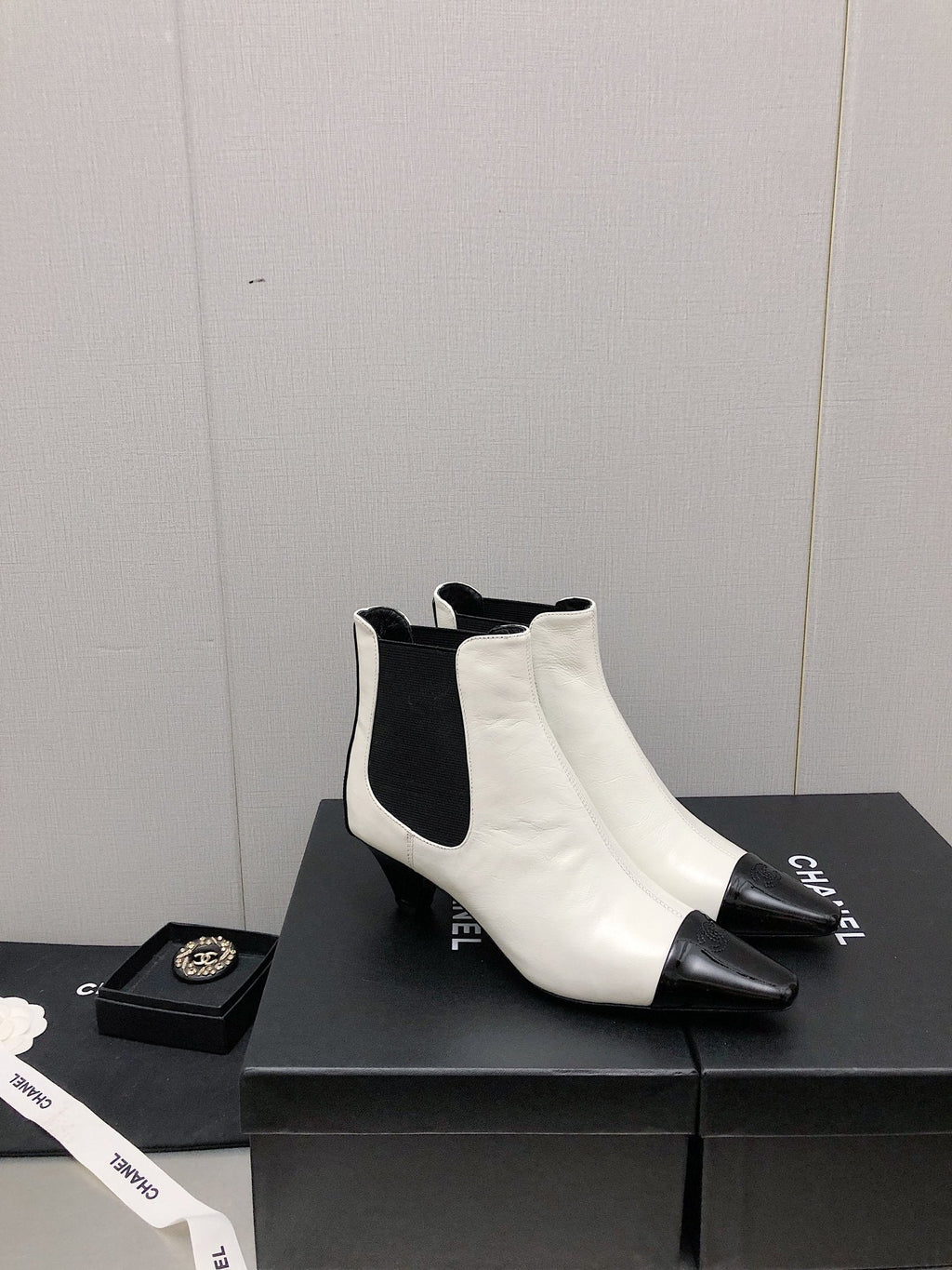 CHANEL SHORT BOOTS IN WHITE MIX BLACK SHEEPSKIN
