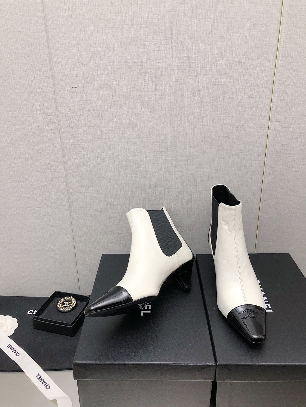 CHANEL SHORT BOOTS IN WHITE MIX BLACK SHEEPSKIN