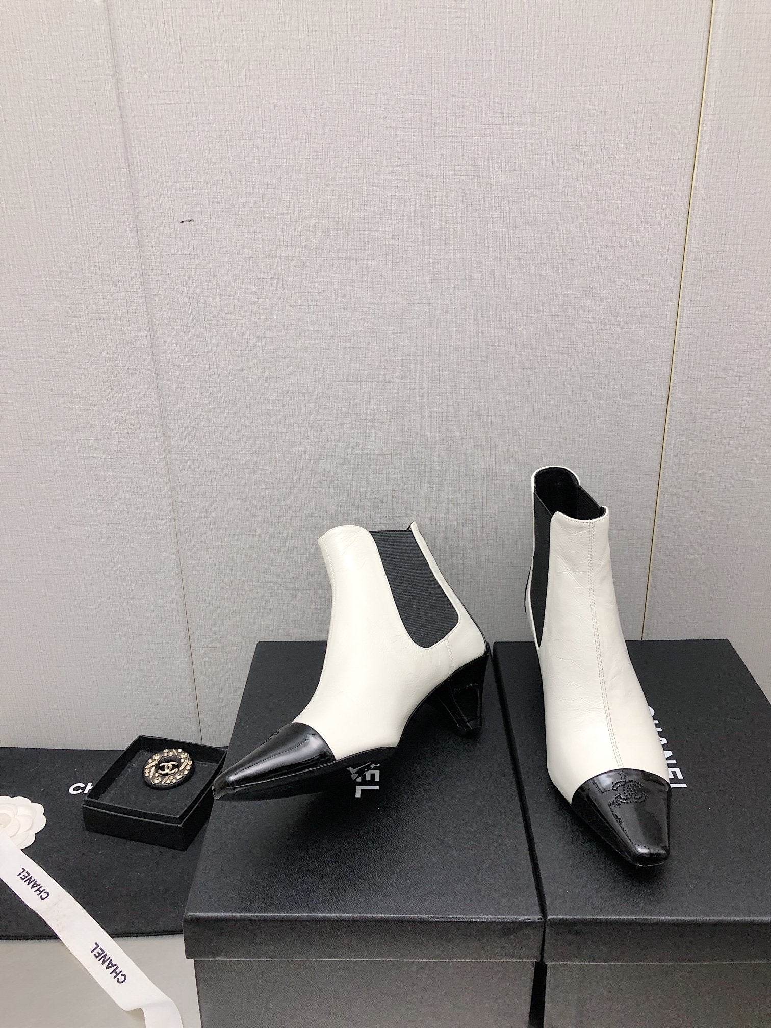 CHANEL SHORT BOOTS IN WHITE MIX BLACK SHEEPSKIN