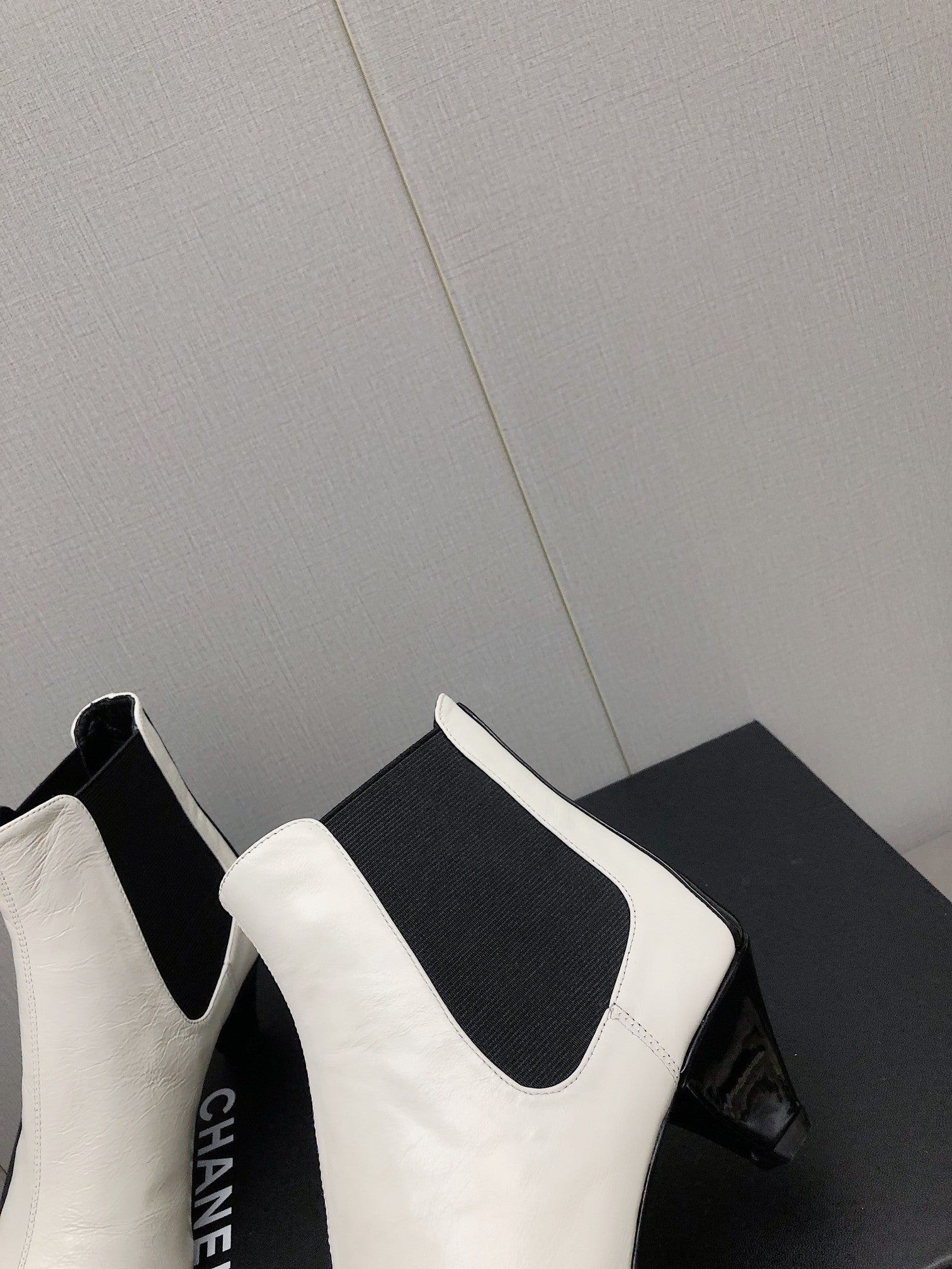 CHANEL SHORT BOOTS IN WHITE MIX BLACK SHEEPSKIN