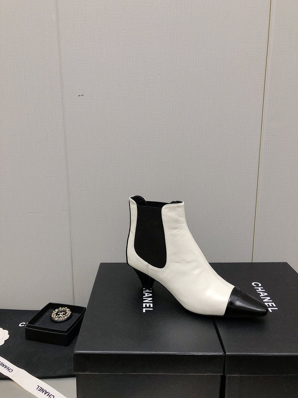 CHANEL SHORT BOOTS IN WHITE MIX BLACK SHEEPSKIN