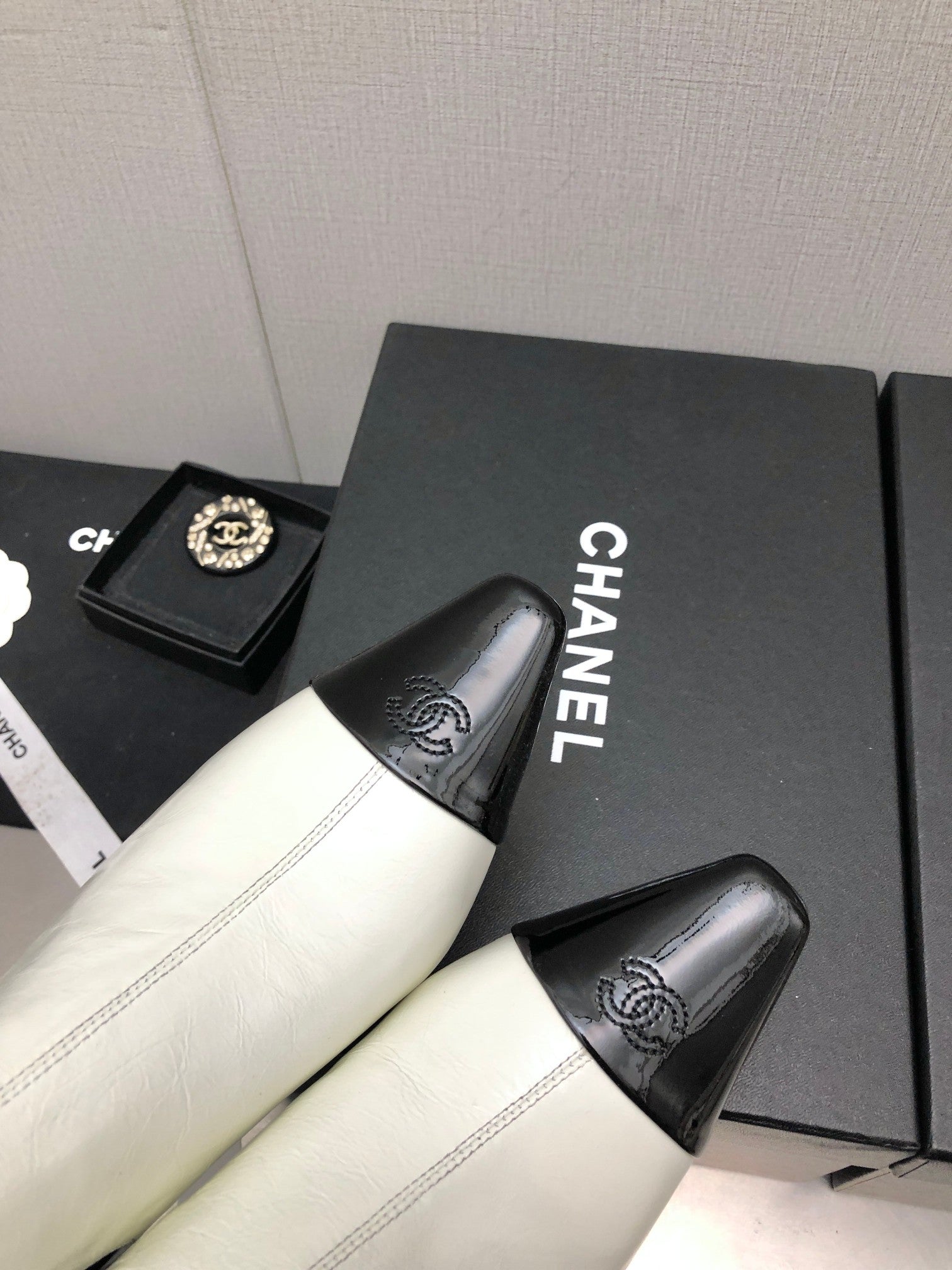 CHANEL SHORT BOOTS IN WHITE MIX BLACK SHEEPSKIN