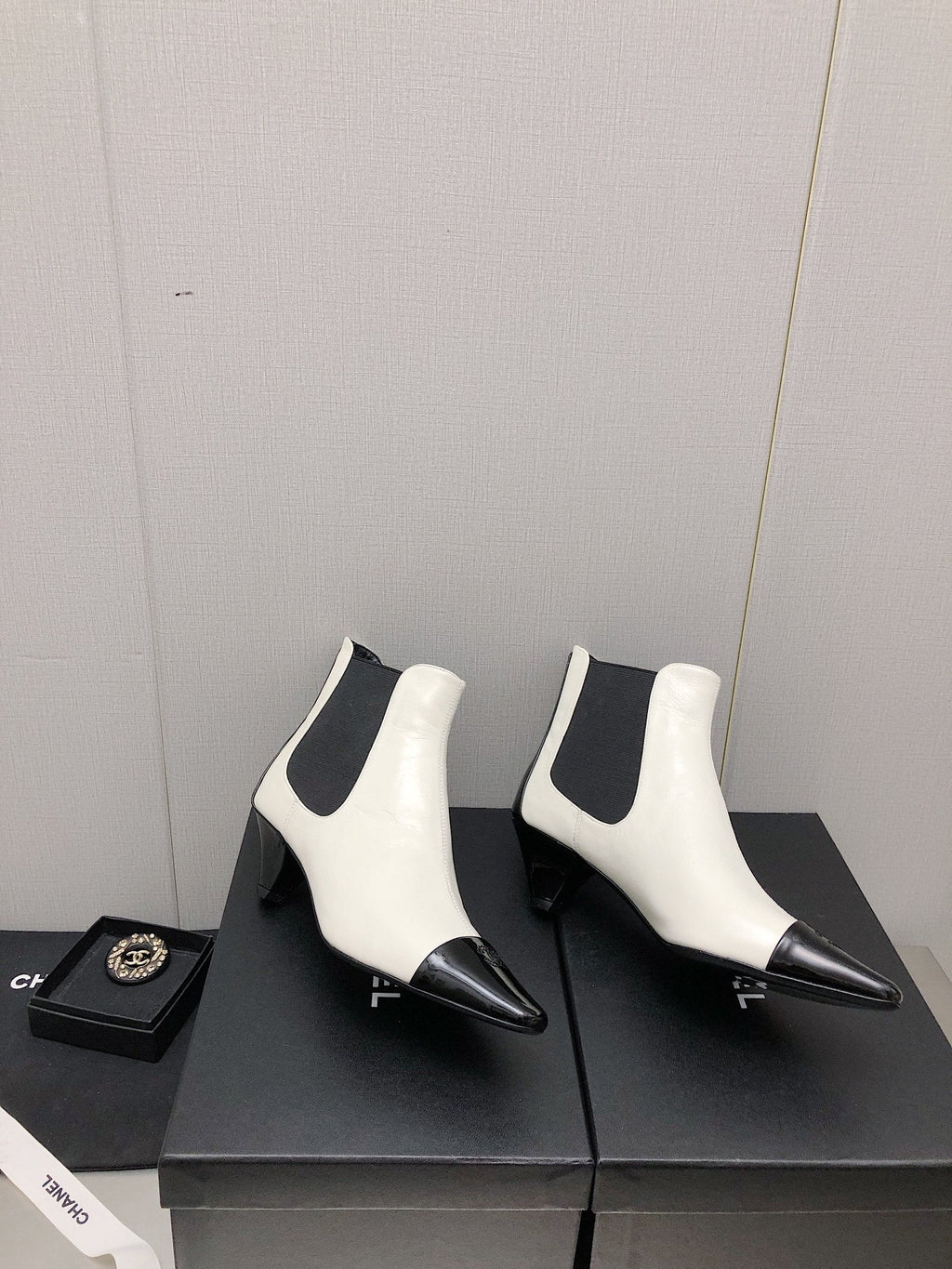 CHANEL SHORT BOOTS IN WHITE MIX BLACK SHEEPSKIN