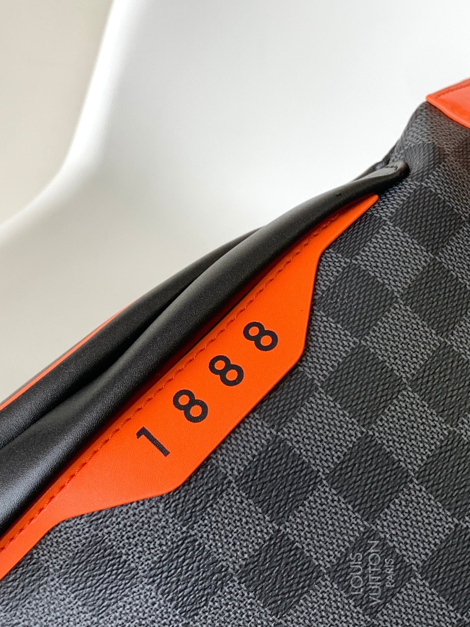 LOUIS VUITTON LV 25S BUMBAG 37 IN BLACK AND ORANGE COATED MONOGRAM CALFSKIN