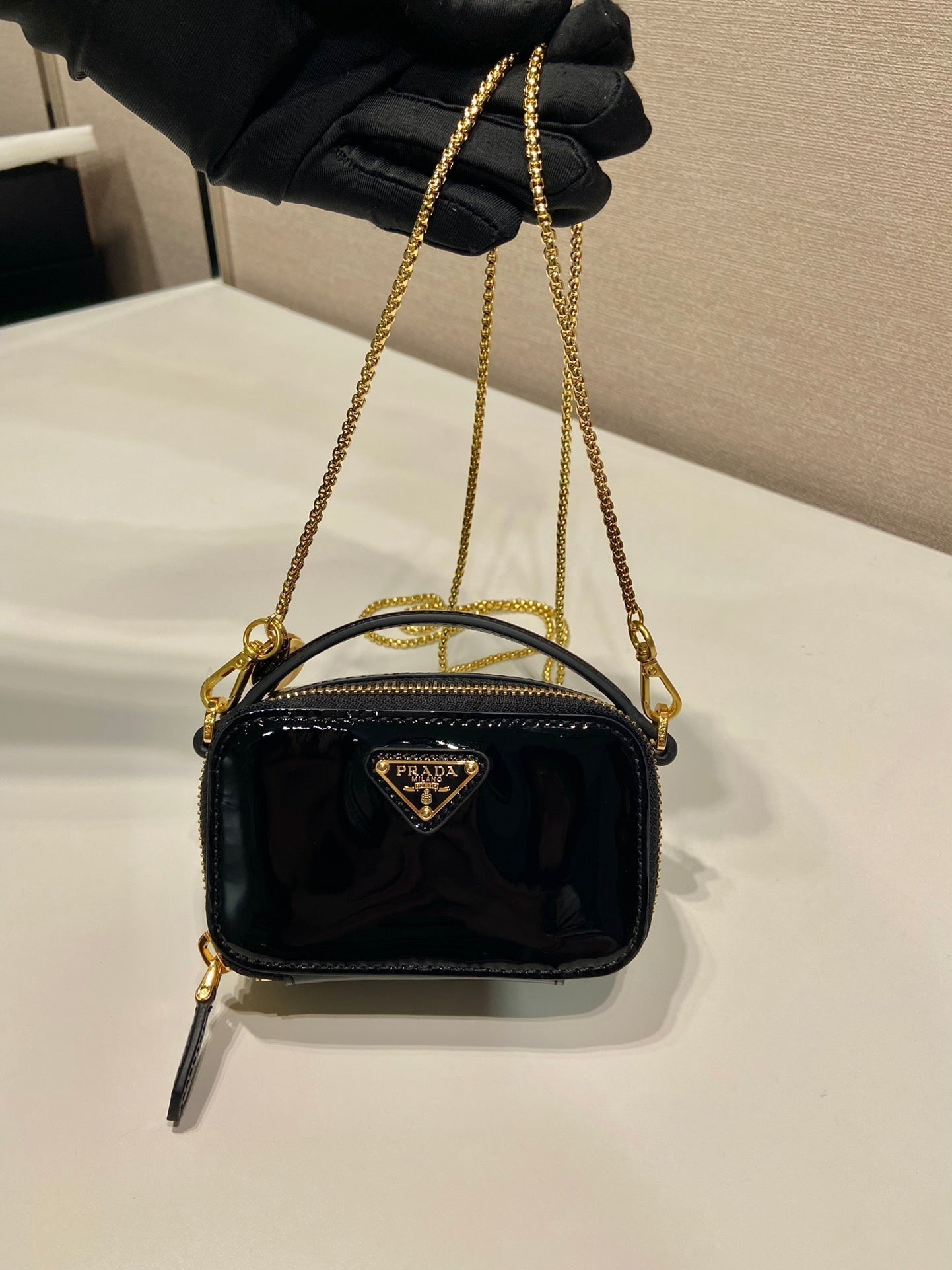PRADA MINI HAND BAG 11 WITH GOLD STRAP IN BLACK PATENT CALFSKIN