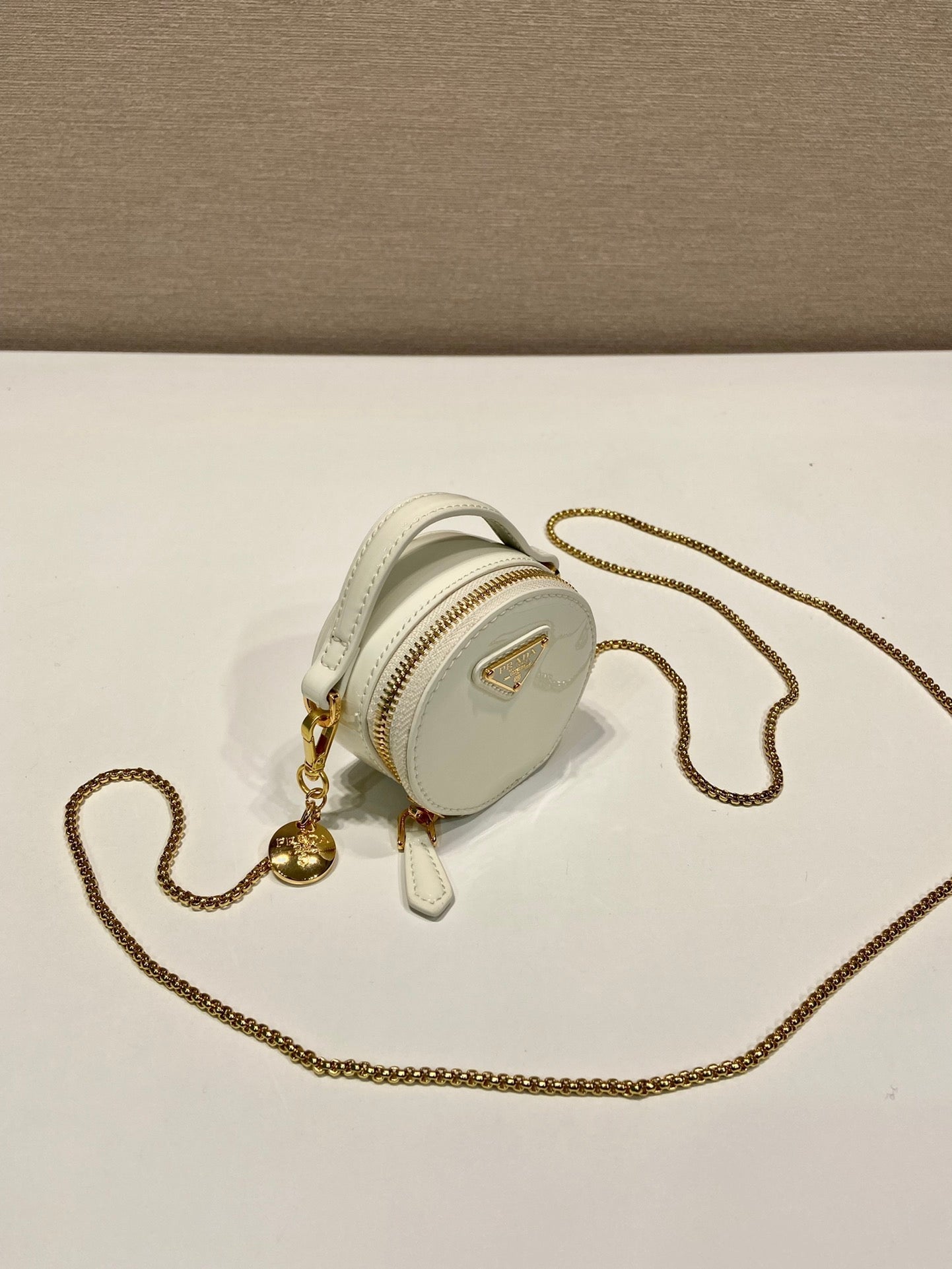 PRADA MINI ROUND BAG 8 IN WHITE GLOSSY CALFSKIN GOLD HARDWARE