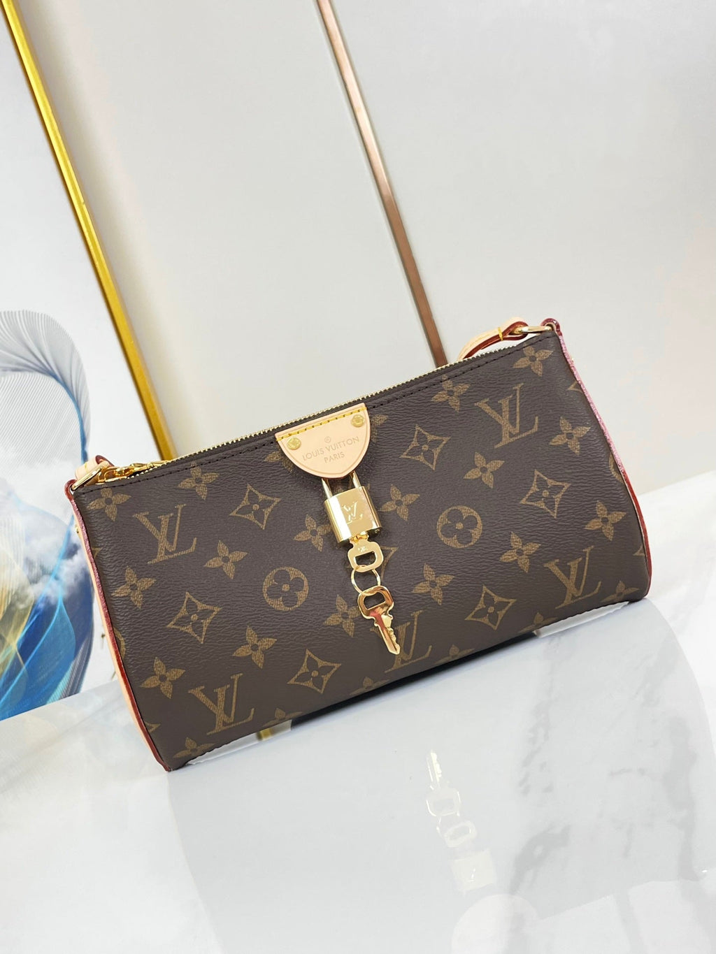 LOUIS VUITTON POCHETTE TIRETTE 22 IN BROWN MONOGRAM CANVAS GOLD BUCKLE