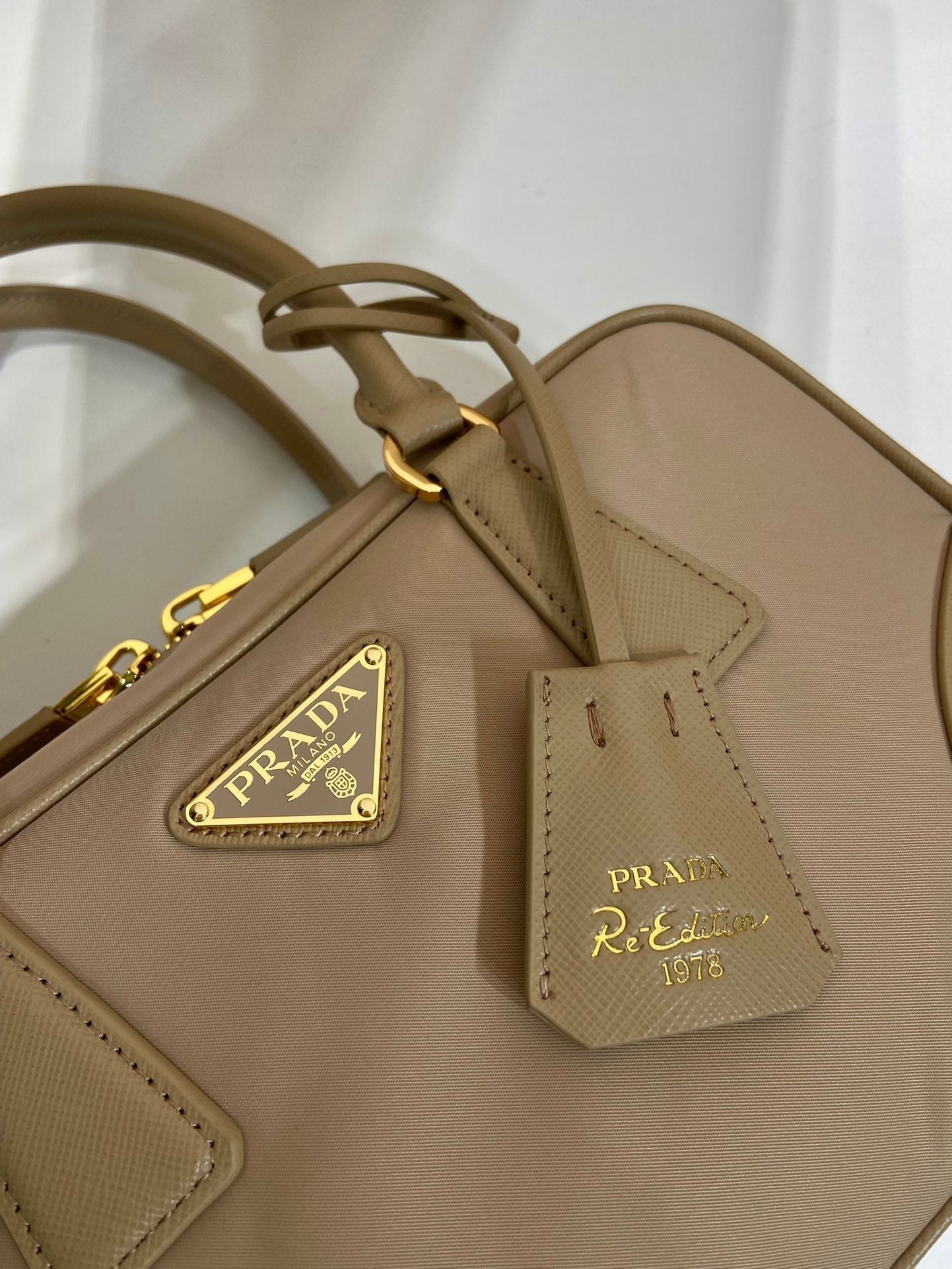 PRADA SMALL TOP HANDLE BAG 25 IN DRIED MOSS NYLON AND CALFSKIN TRIM