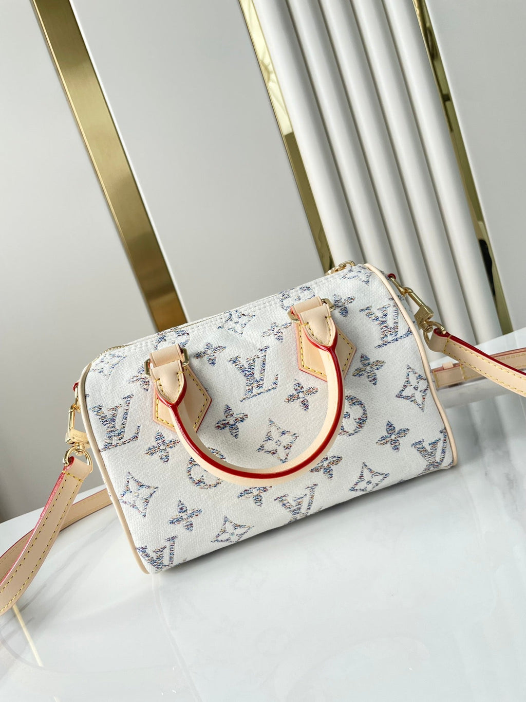 LOUIS VUITTON SPEEDY BANDOULIÈRE 20 IN WHITE MONOGRAM JACQUARD FABRIC AND BEIGE CALFSKIN TRIM