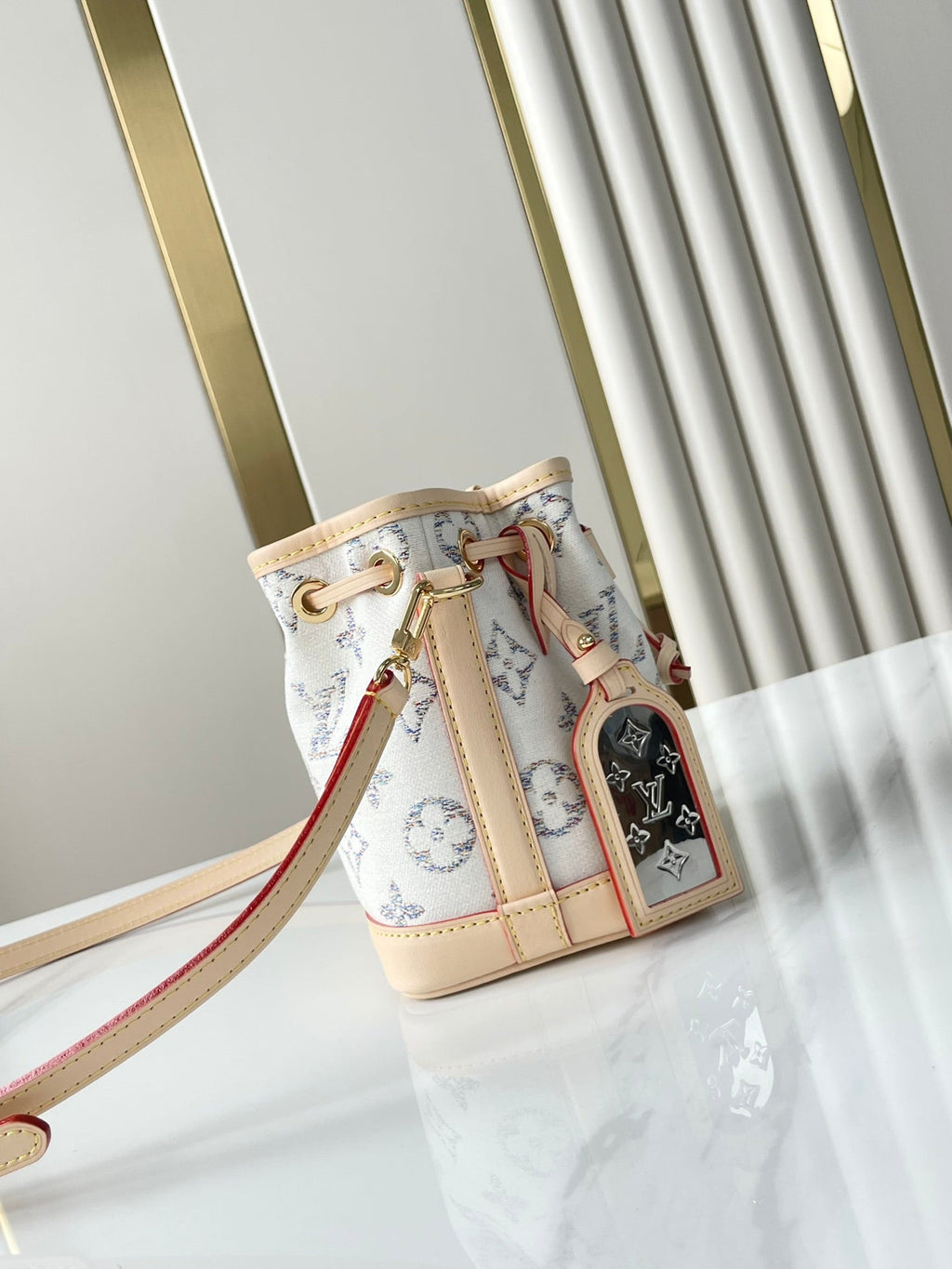 LOUIS VUITTON NANO NOÉ 16 IN WHITE MONOGRAM JACQUARD FABRIC AND BEIGE CALFSKIN TRIM