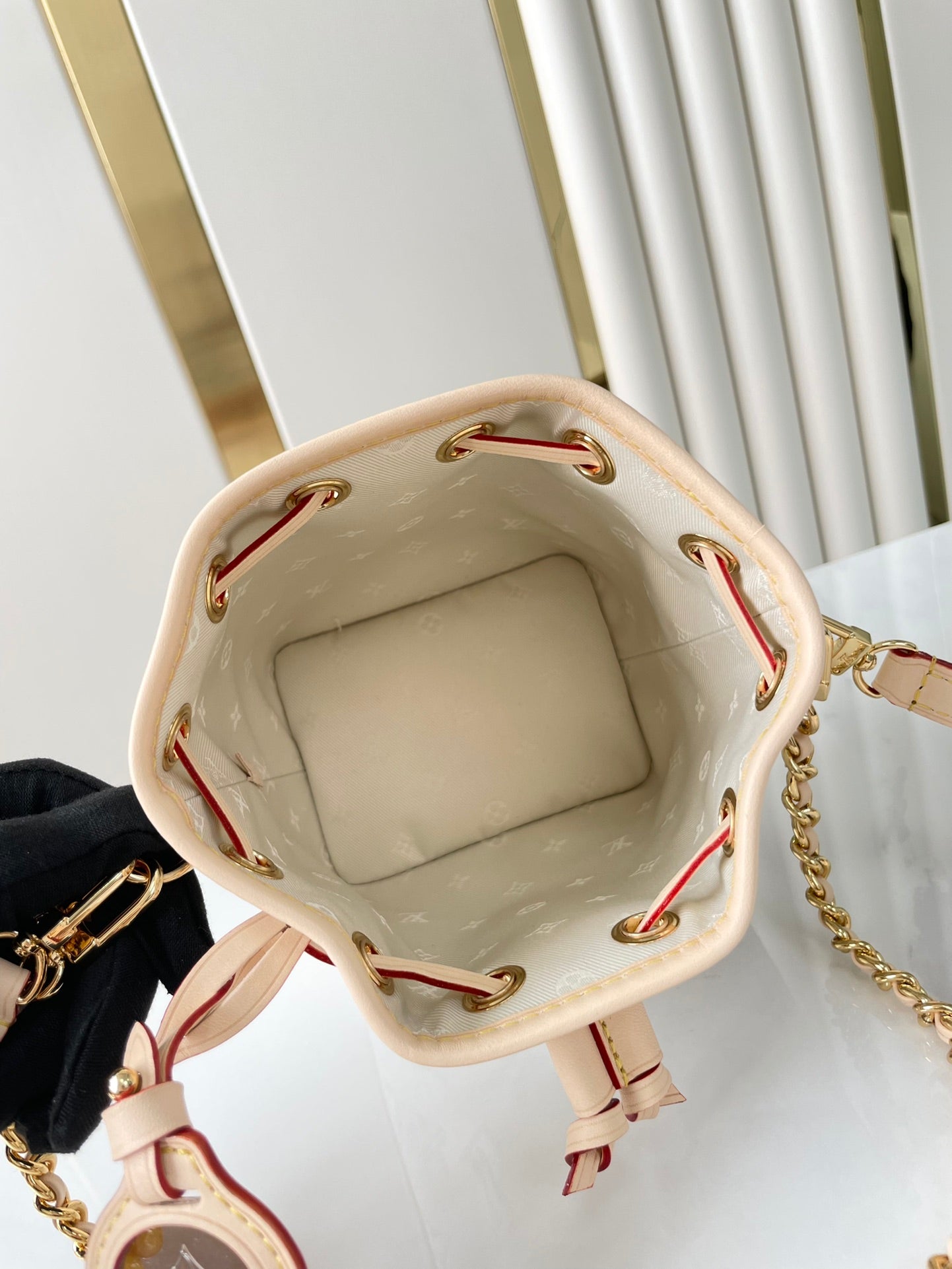 LOUIS VUITTON NANO NOÉ 16 IN WHITE MONOGRAM JACQUARD FABRIC AND BEIGE CALFSKIN TRIM