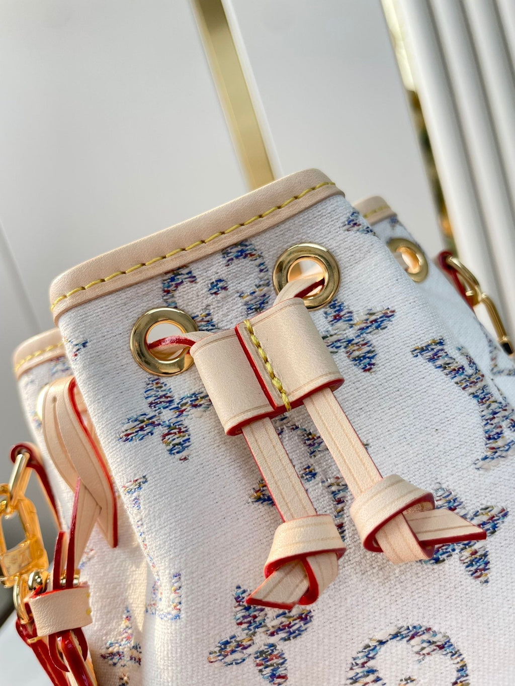 LOUIS VUITTON NANO NOÉ 16 IN WHITE MONOGRAM JACQUARD FABRIC AND BEIGE CALFSKIN TRIM