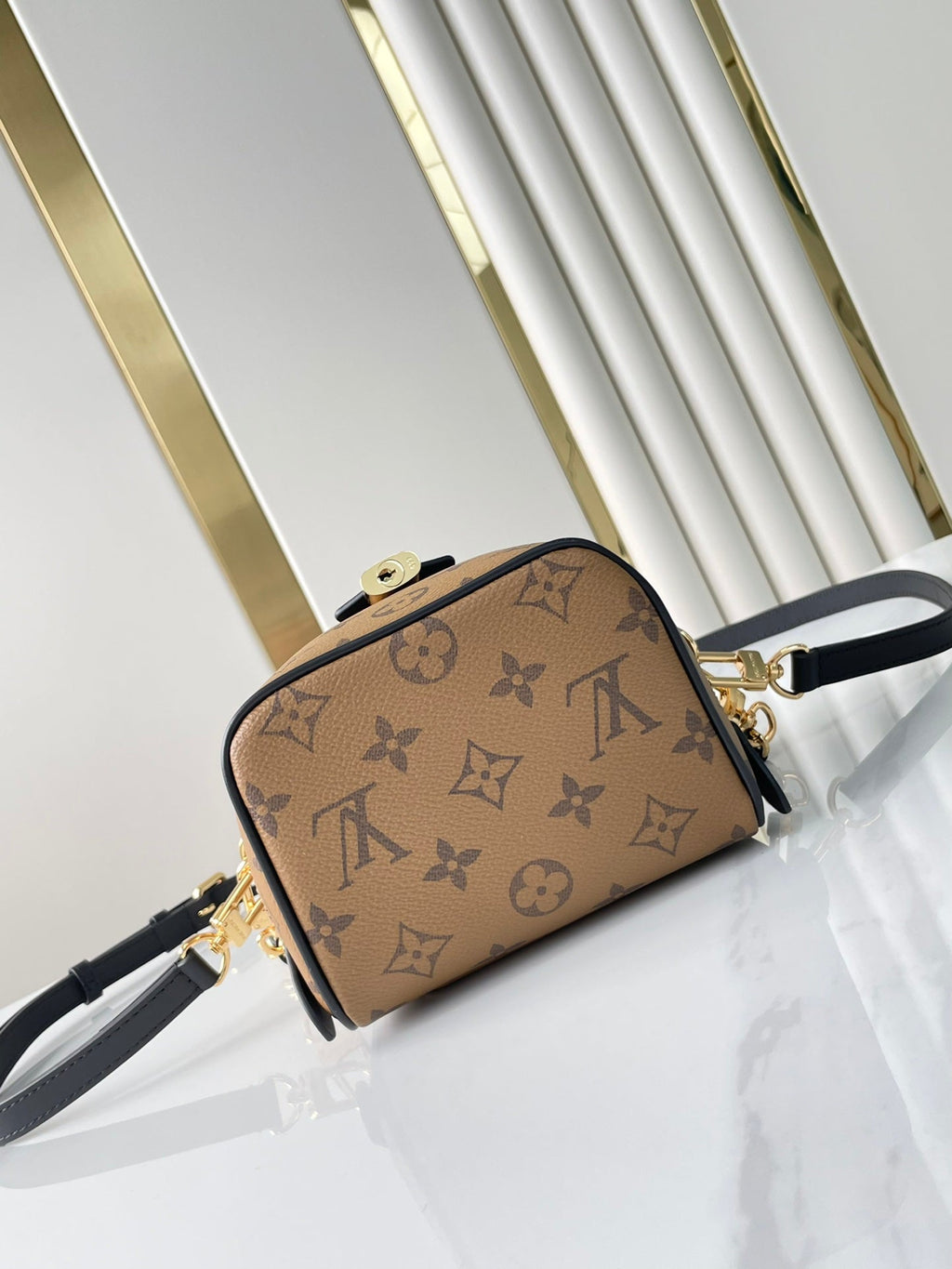 LOUIS VUITTON JUST IN CASE 14 IN BROWN MONOGRAM REVERSE CANVAS GOLD HARDWARE