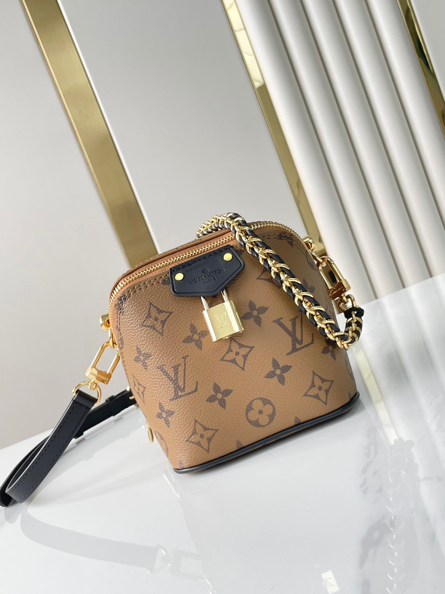 LOUIS VUITTON JUST IN CASE 14 IN BROWN MONOGRAM REVERSE CANVAS GOLD HARDWARE